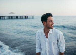 man in white shirt with healthy hair